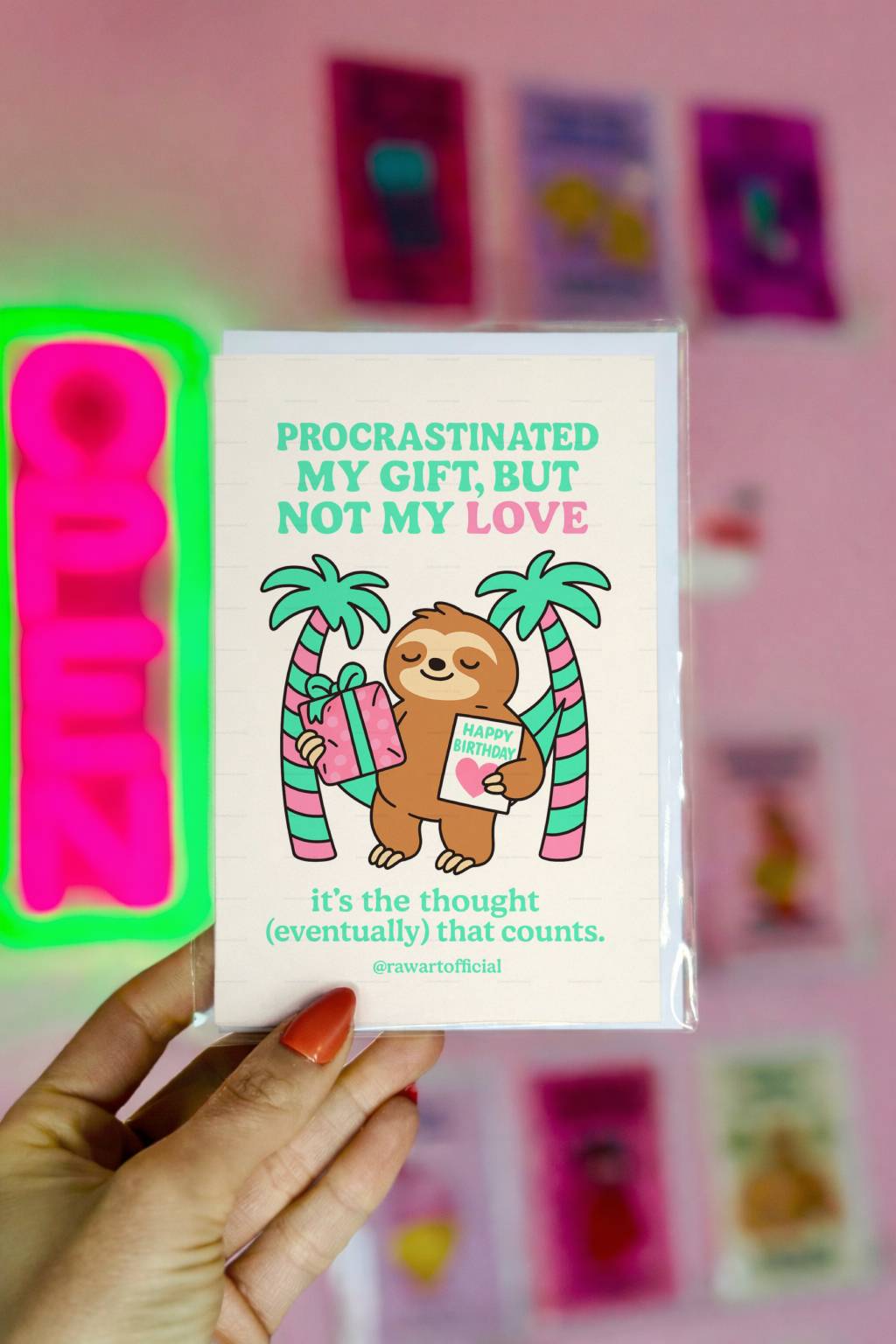Cream birthday card featuring sloth holding gift with text “Procrastinated My Gift, But Not My Love.”