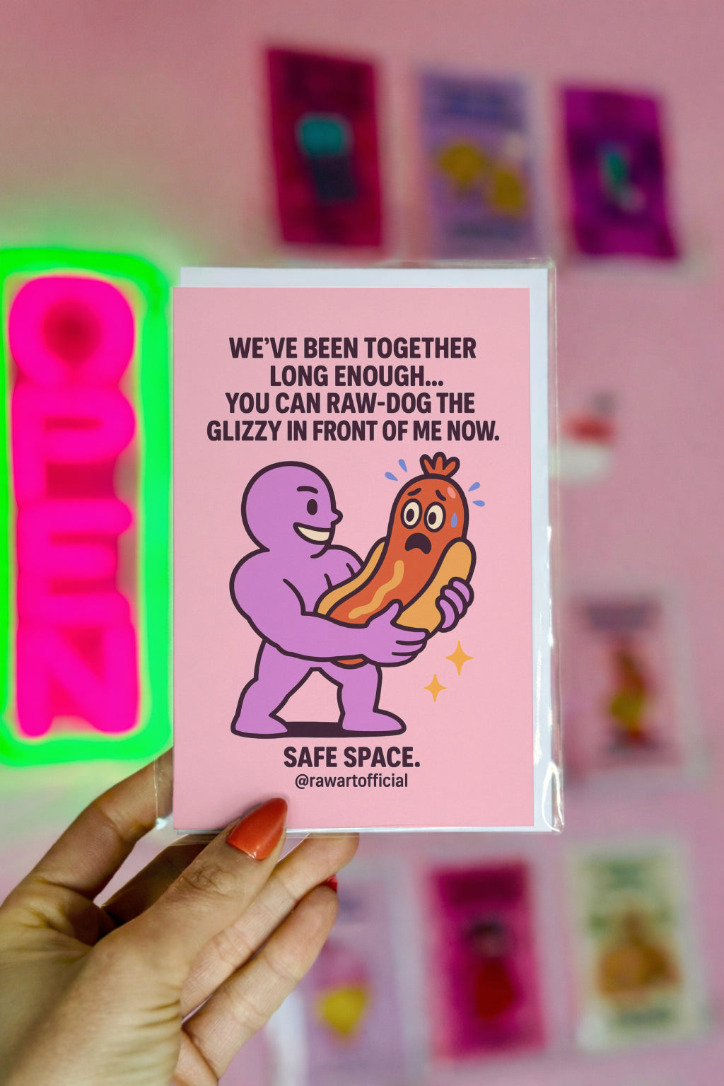Illustration of a purple buff character holding a worried hot dog in its bun like a romantic gesture, with bold anniversary text above.