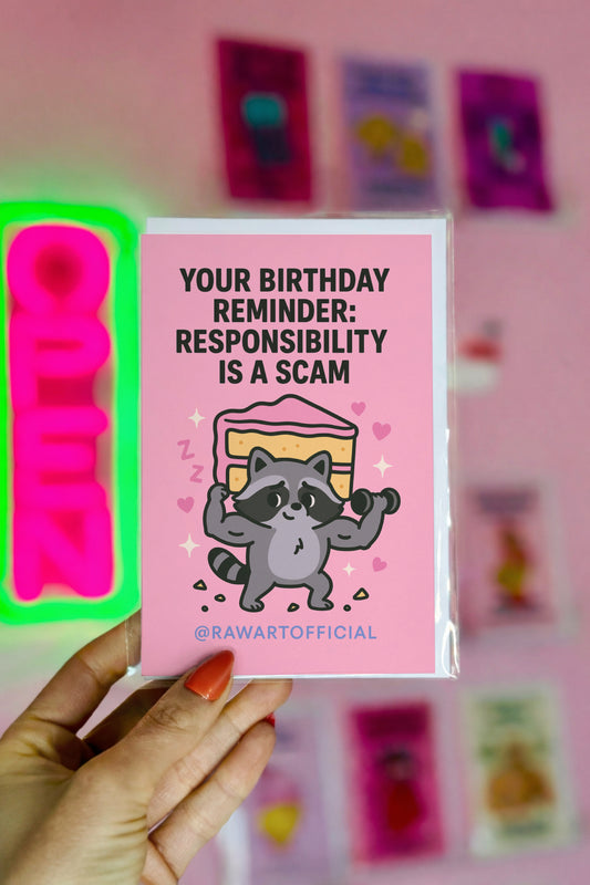 Funny pink birthday card with a cute muscular raccoon lifting cake and text “Responsibility is a scam.”