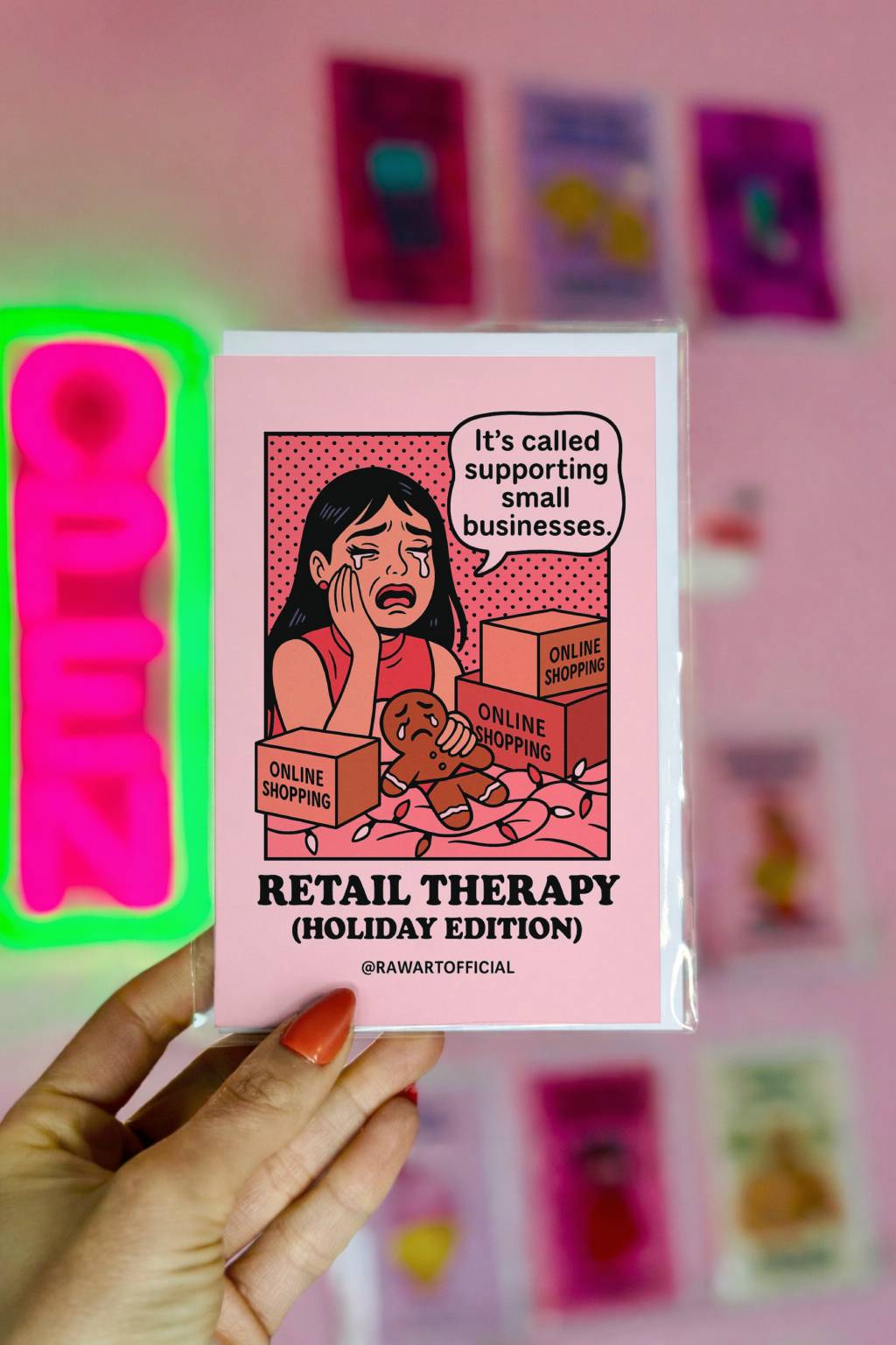Pink holiday card featuring a crying retro-style girl surrounded by online shopping boxes with the phrase “Retail Therapy Holiday Edition.”