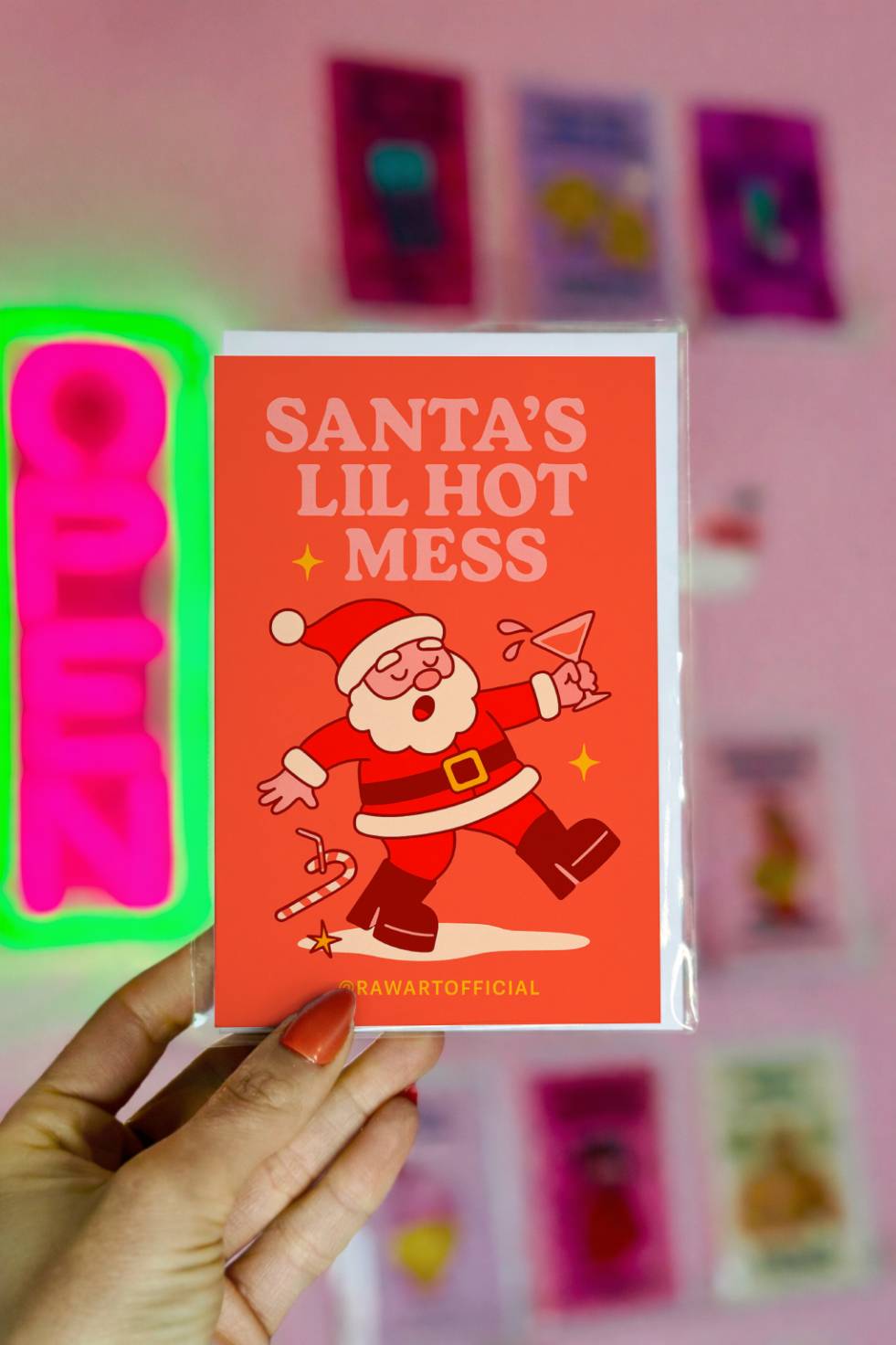 Funny Christmas greeting card with tipsy Santa and text “Santa’s Lil Hot Mess.”