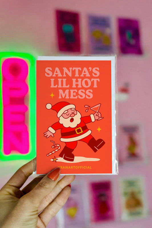 Funny Christmas greeting card with tipsy Santa and text “Santa’s Lil Hot Mess.”