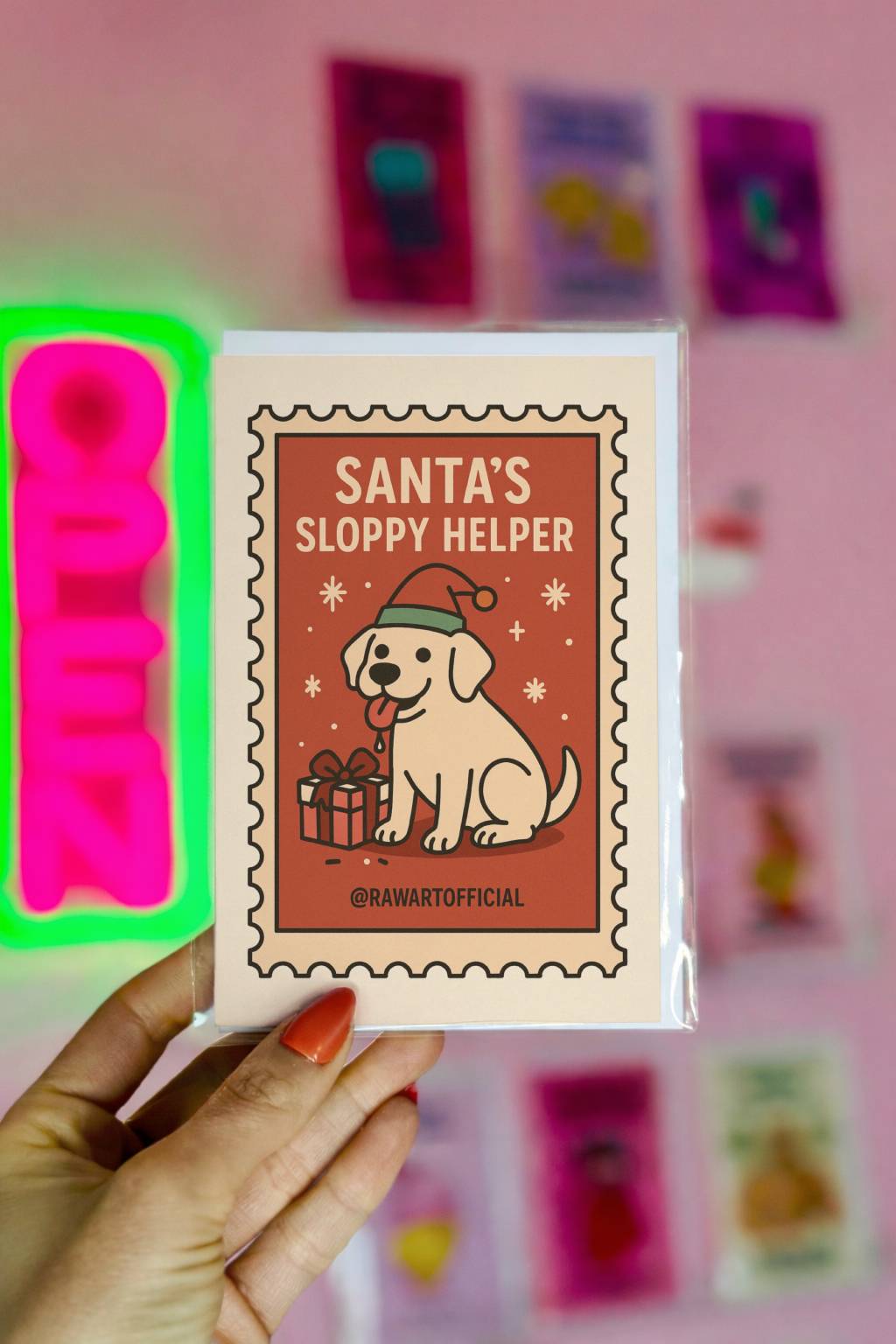 Retro Christmas greeting card featuring a Labrador dog wearing a Santa hat with a gift and text “Santa’s Sloppy Helper” in a vintage stamp-style design