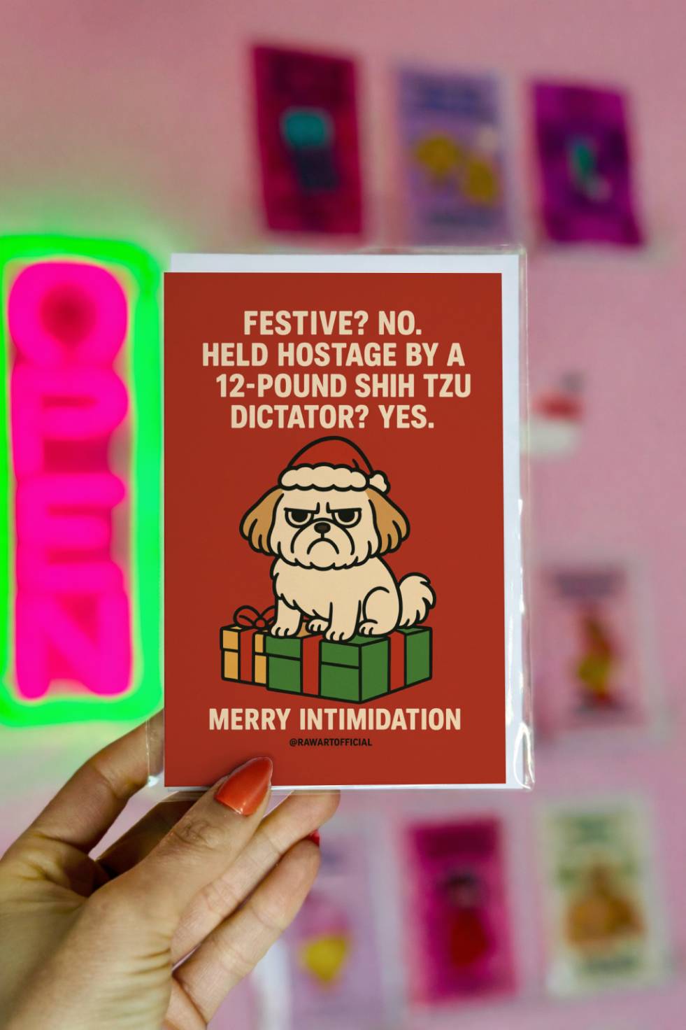 Funny Shih Tzu Christmas card with grumpy dog in Santa hat sitting on presents and text “Held Hostage by a 12 Pound Shih Tzu Dictator Merry Intimidation.”
