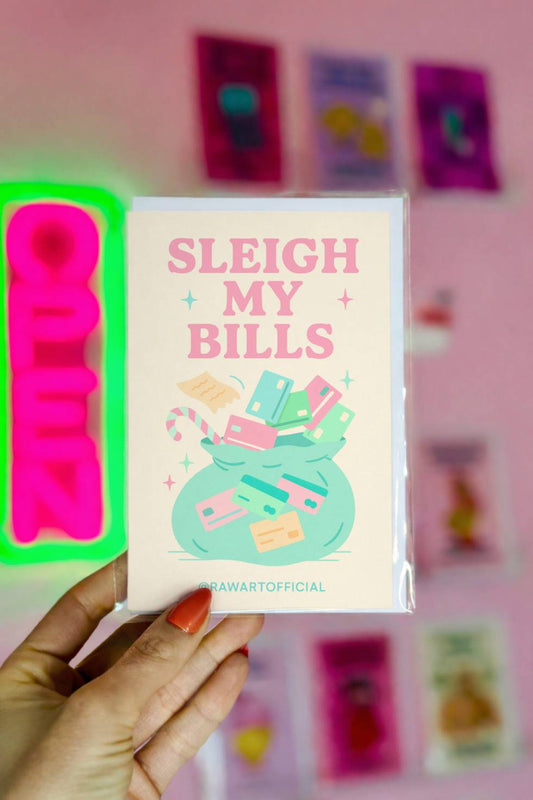 Funny Christmas greeting card with money bag and credit cards and text “Sleigh My Bills.”