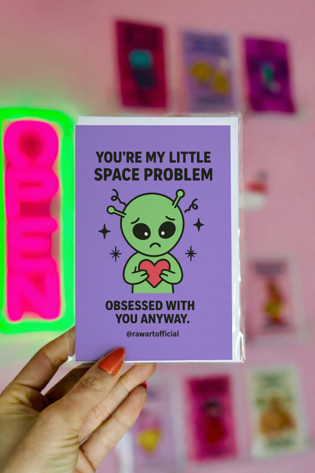 Cute sad green alien holding a red heart with text “You’re My Little Space Problem.”