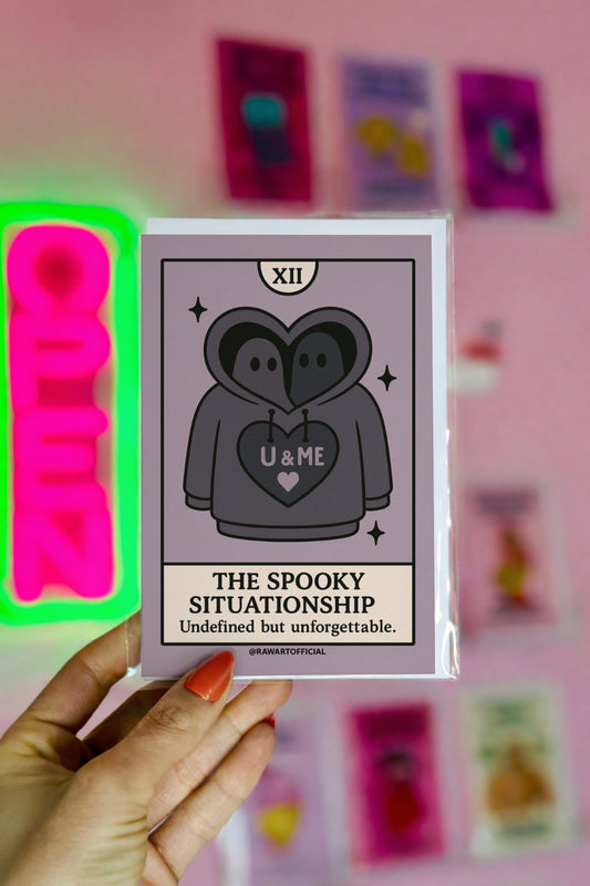 Two hooded ghosts sharing a hoodie with “U & ME” heart, spooky situationship tarot-style design.