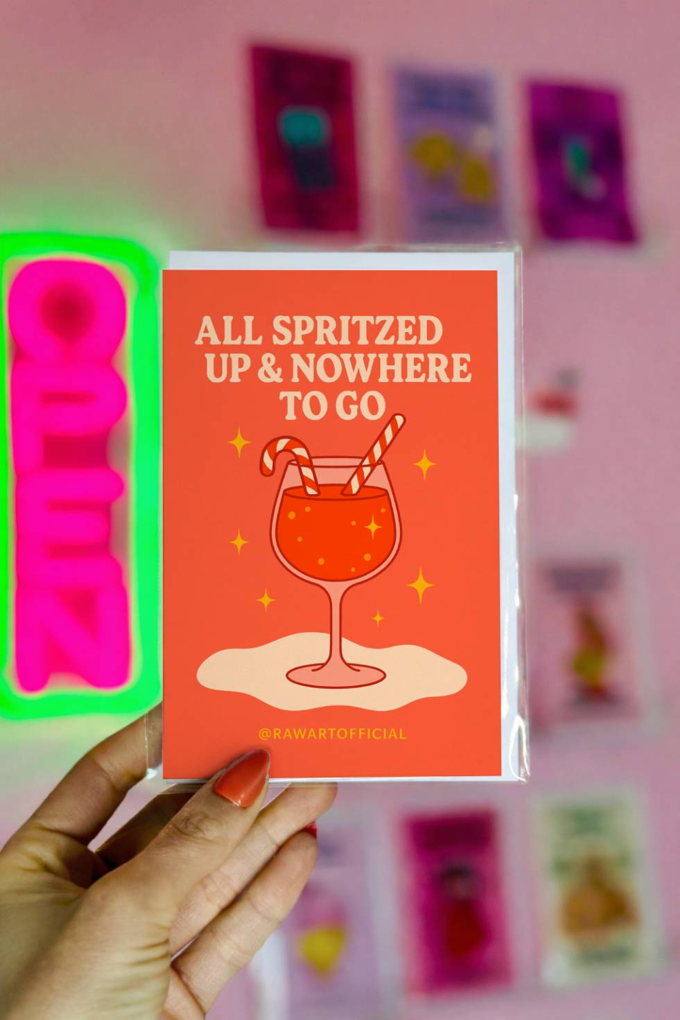 Funny Christmas greeting card featuring a festive cocktail with candy cane straws and text reading “All Spritzed Up and Nowhere to Go.”