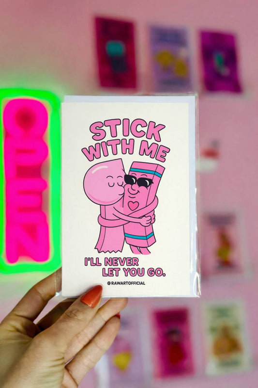 Greeting card with a cartoon pink gum hugging a candy stick in sunglasses, text reads “Stick With Me — I’ll Never Let You Go.” Signature @rawartofficial.