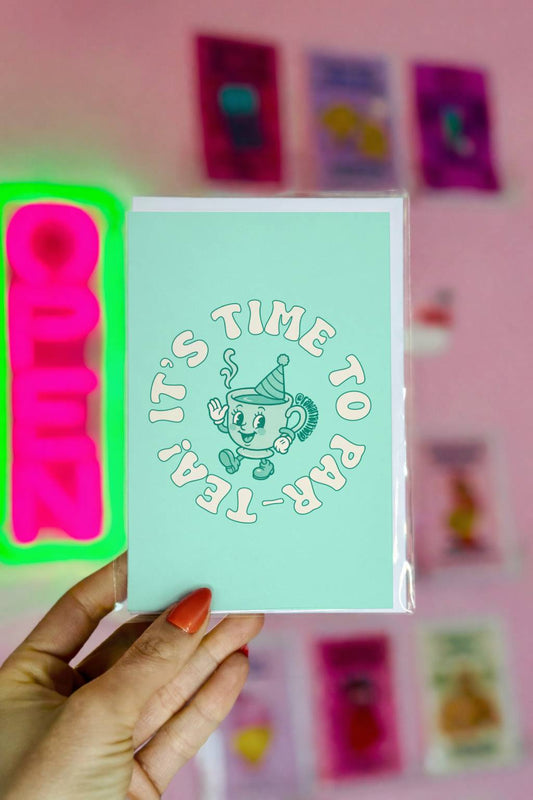 Mint green birthday card with retro teacup wearing party hat and circular text reading “It’s Time to Par-Tea.”