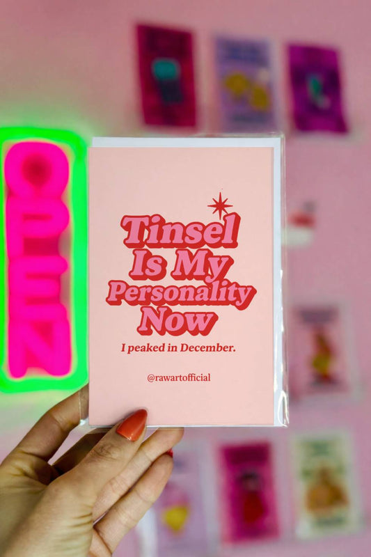 Funny Christmas card with retro red lettering that reads “Tinsel Is My Personality Now. I peaked in December.”