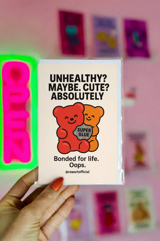 Funny greeting card showing two gummy bears holding super glue with text “Unhealthy? Maybe. Cute? Absolutely. Bonded for life.”