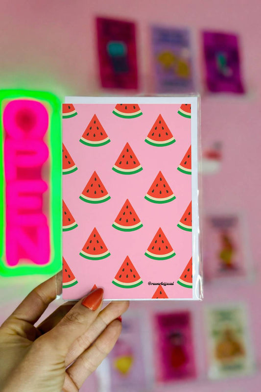 Greeting card featuring a repeating pattern of watermelon slices on a pink background.