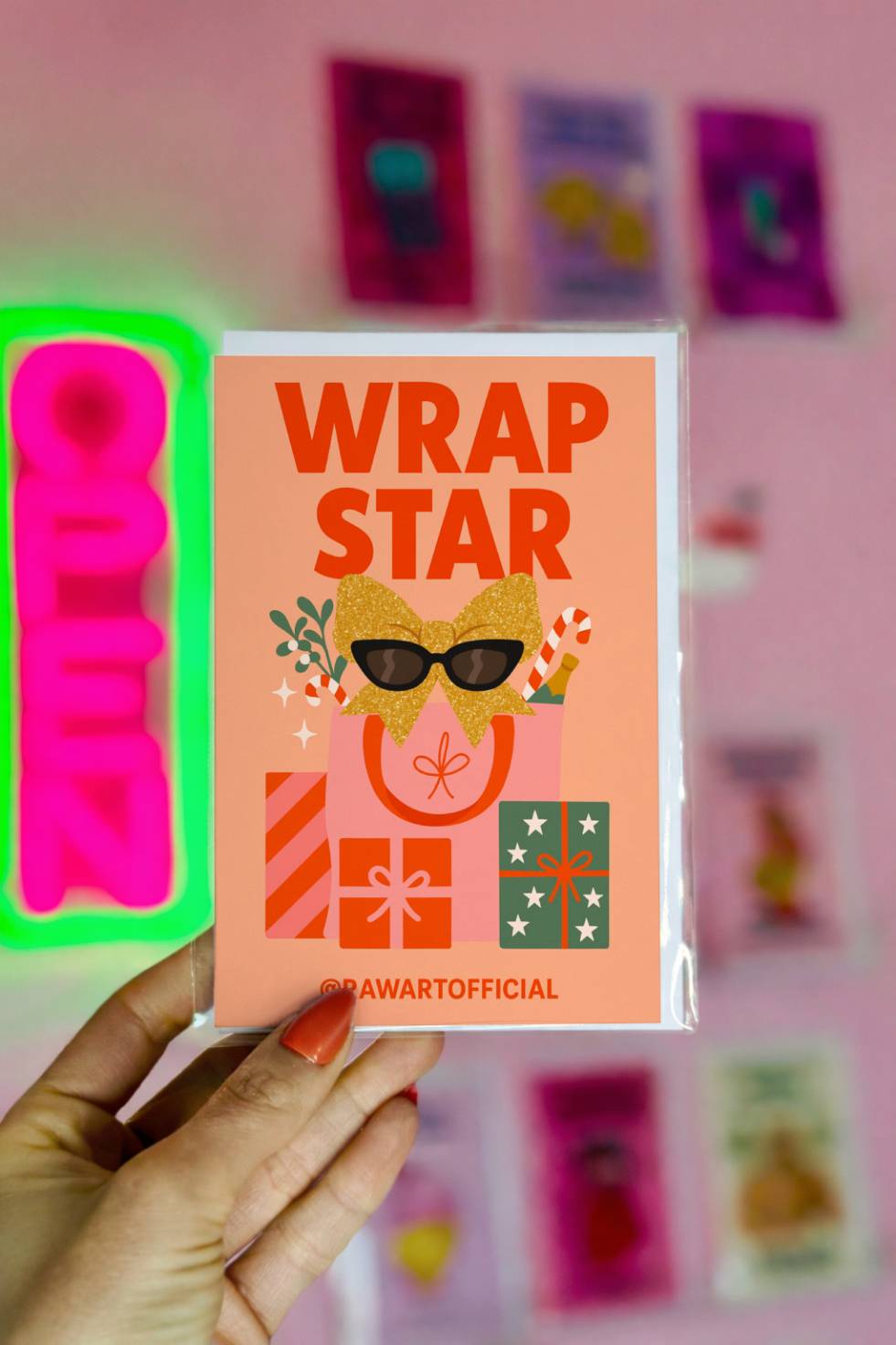 Funny Christmas greeting card with gifts and sunglasses bow and text “Wrap Star.”
