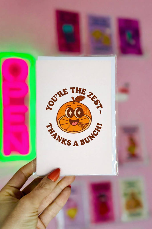 Minimal thank you card featuring a smiling cartoon orange with sparkly eyes and text reading “You’re the Zest – Thanks a Bunch!”