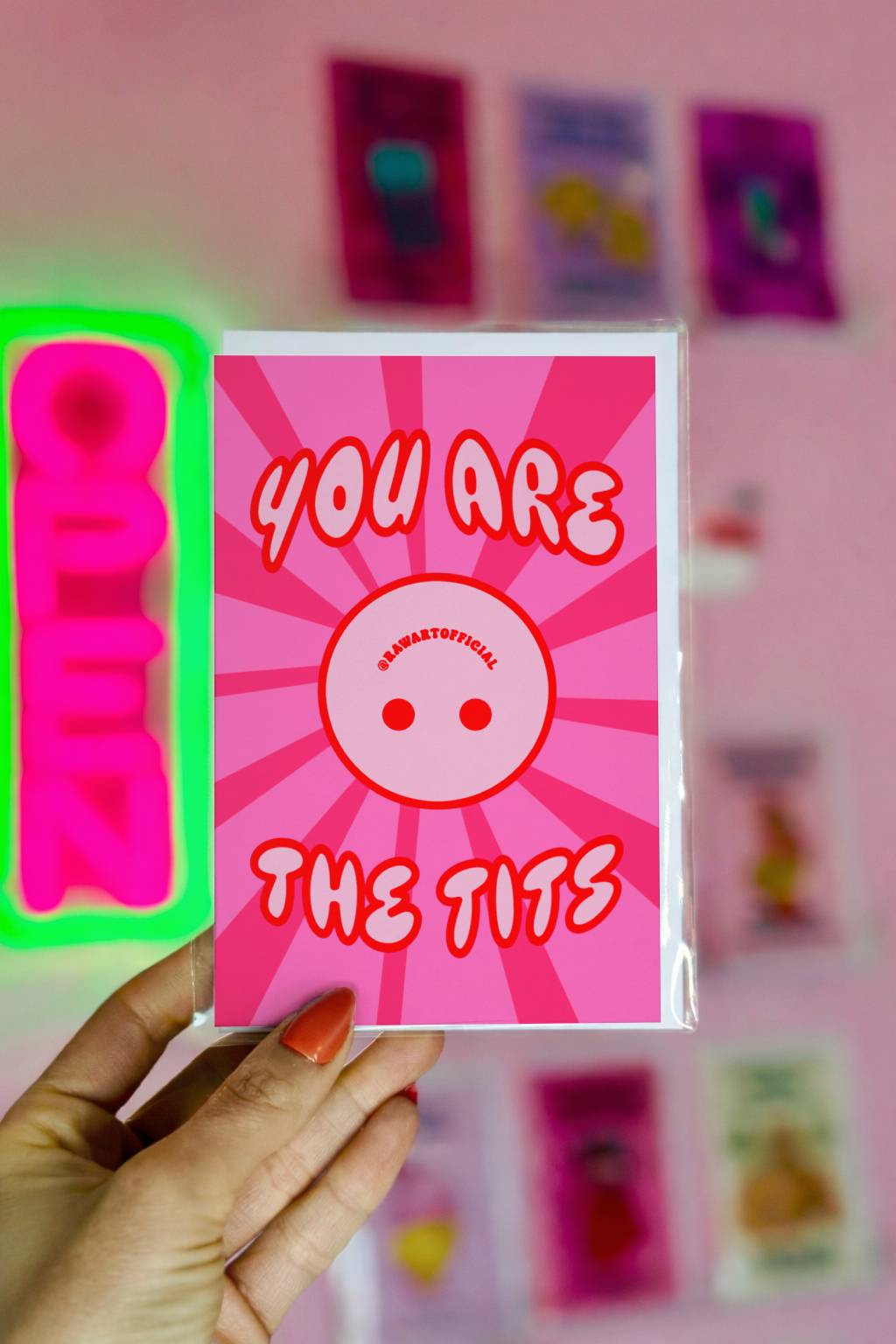 Bright pink funny love card with text You Are the Tits and bold burst background.