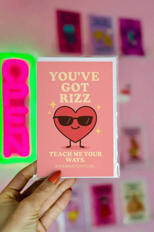 Greeting card with a cool heart wearing sunglasses and text reading “You’ve Got Rizz.”